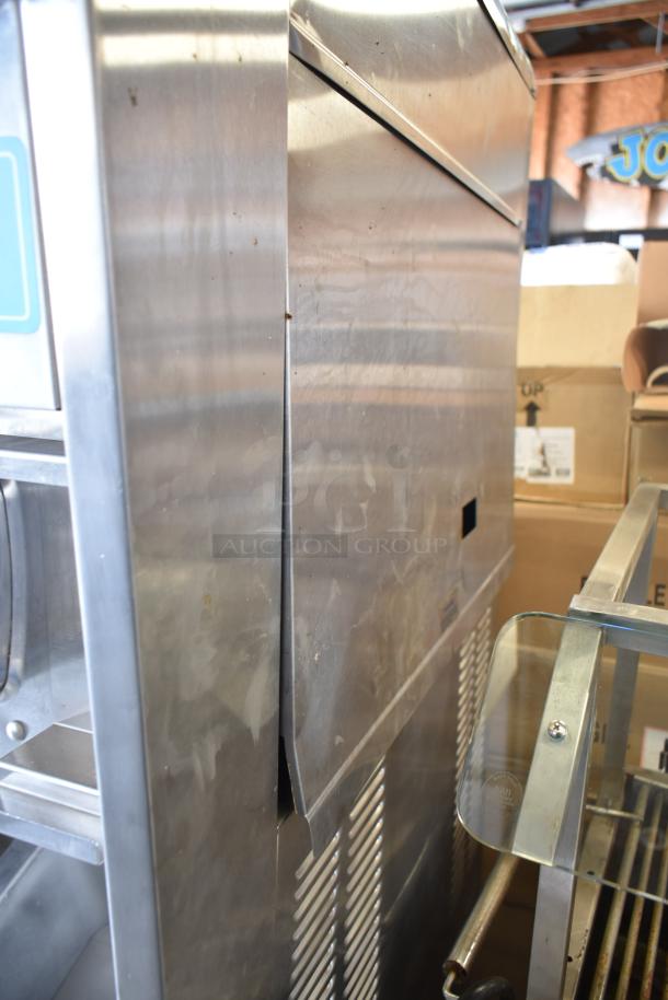 Taylor S757-33 commercial soft serve machine, floor style, 2 flavors with twist. Stainless steel, 208-230V, 3 phase. Used.