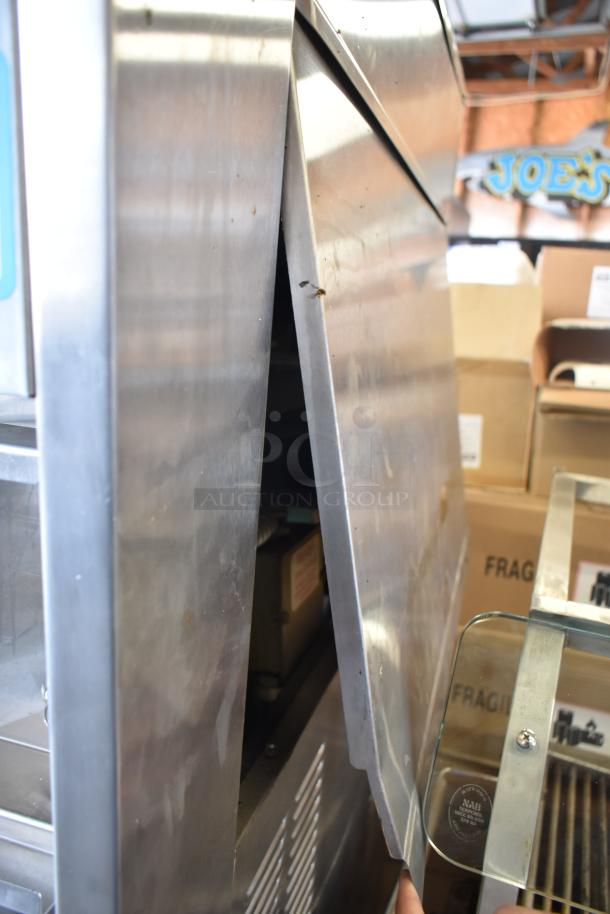 Taylor S757-33 soft serve ice cream machine, 2-flavor with twist, 208-230V, 3 phase. Stainless steel exterior, needs cleaning.