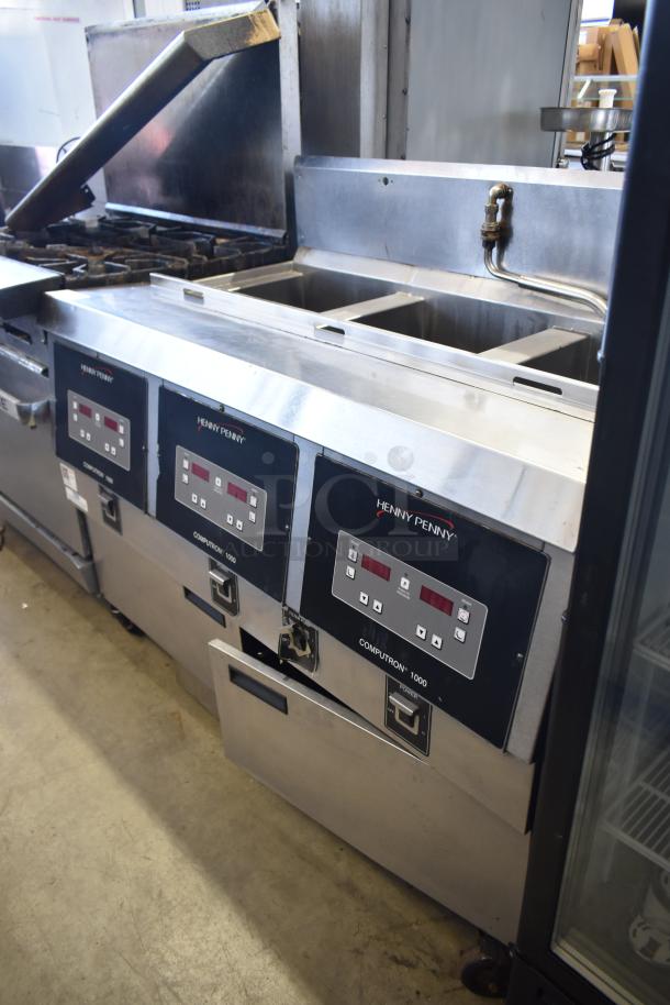 Henny Penny OFG-323 commercial gas fryer, 3 bay, on casters, with digital controls.