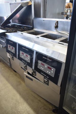 Henny Penny OFG-323 commercial gas fryer, 3 bay, on casters, with digital controls.