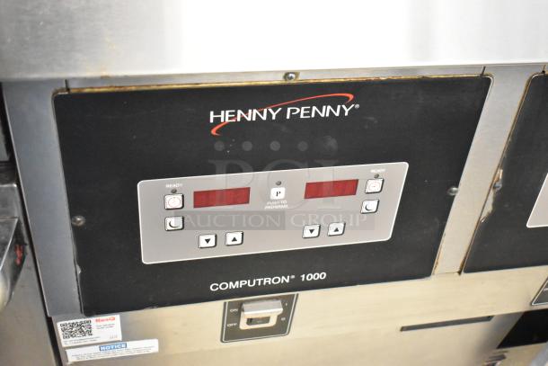 Henny Penny OFG-323 Commercial Gas Fryer, 3-bay, digital controls, on casters, visible brand logo and model panel.