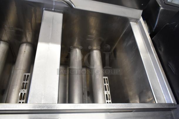 Henny Penny OFG-323 3-bay deep fat fryer, natural gas, on commercial casters, stainless steel, excellent condition.