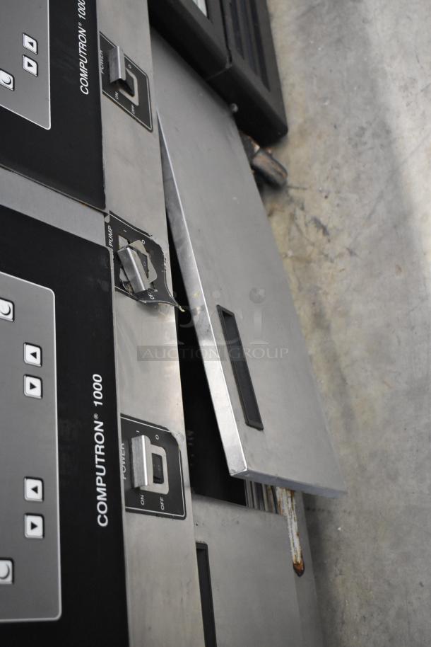 Henny Penny OFG-323 gas fryer, 3 bay, on commercial casters, features Computron 1000 controls, visible wear on panel.