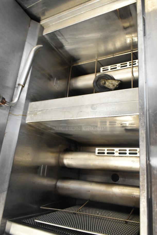 2019 Henny Penny OFG-322 deep fat fryer, commercial-grade, natural gas, 170,000 BTU, on casters, interior view of bays.