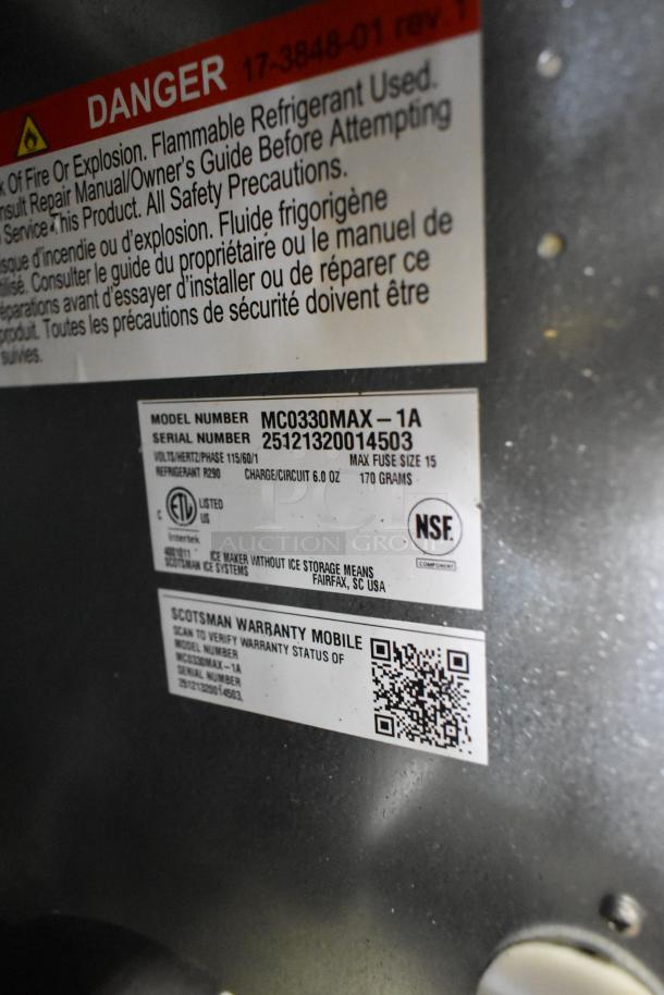 "Scotsman MC0330MAX-1A Ice Machine labels showing model, serial number, voltage, and safety warnings, new condition."