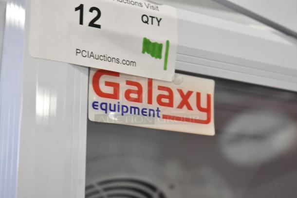 BRAND NEW Galaxy 177GDN5RBW glass door merchandiser refrigerator, white, LED lighting, 115V. Visible Galaxy label.