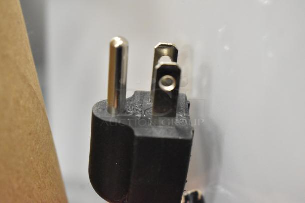 Close-up of power plug for Galaxy 177GDN5RBW refrigerator. Two-prong, grounded design in black plastic.