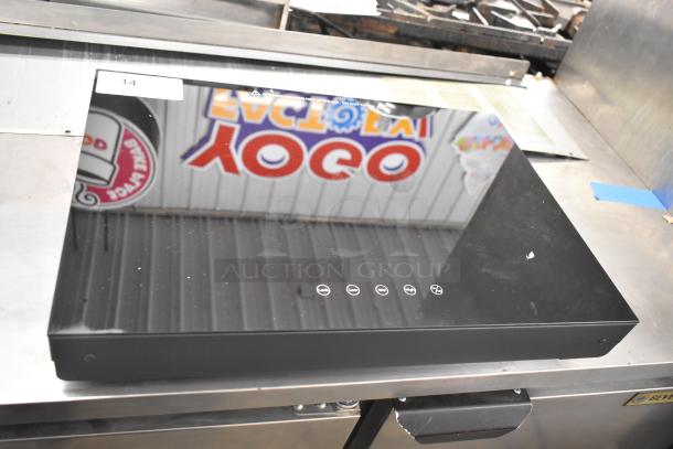 Brand new 2025 Avantco 177ICW375 black induction warmer, 16" x 23", countertop model. Minor blemishes visible. 120V, 1-phase.