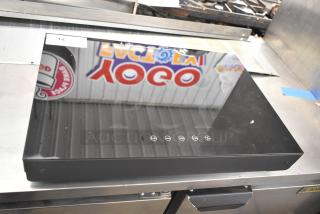 Brand new 2025 Avantco 177ICW375 black induction warmer, 16" x 23", countertop model. Minor blemishes visible. 120V, 1-phase.