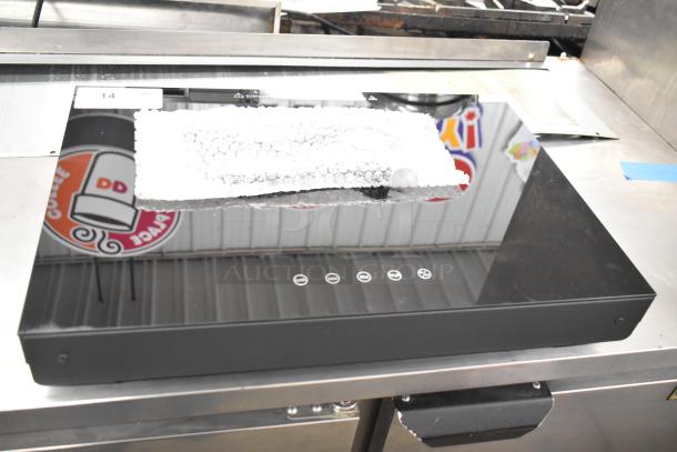 Avantco 177ICW375 black countertop induction warmer, 16"x23", 120V, new condition with tag visible.