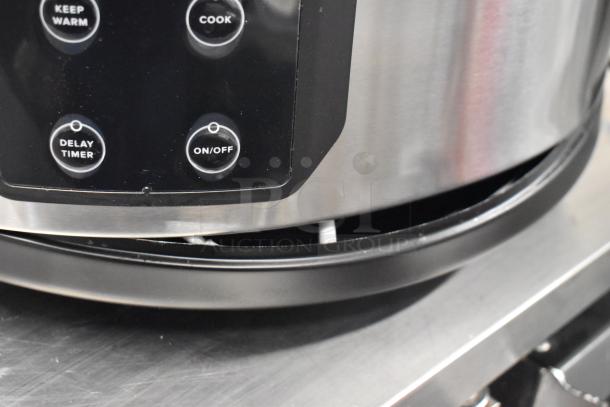 Avantco 177RCSB90 digital rice cooker/warmer, new with scratches, 90 cup capacity, control panel buttons visible.