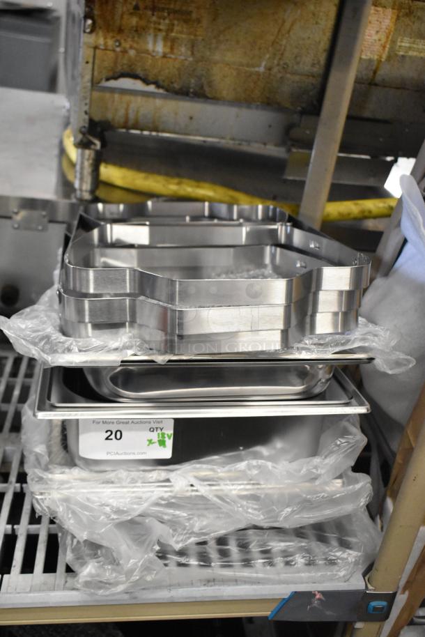 18 brand new scratch and dent items, including chafing dish frames and drop-in bins, with visible auction labels.