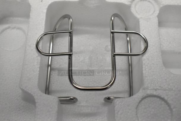 Metal stand component in foam packaging, part of the Waring WWD180X immersion blender.