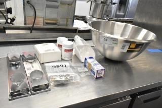 10 new scratch and dent items, including mixing bowl, door switch, cleaning tablets. Stainless steel bowl with label.