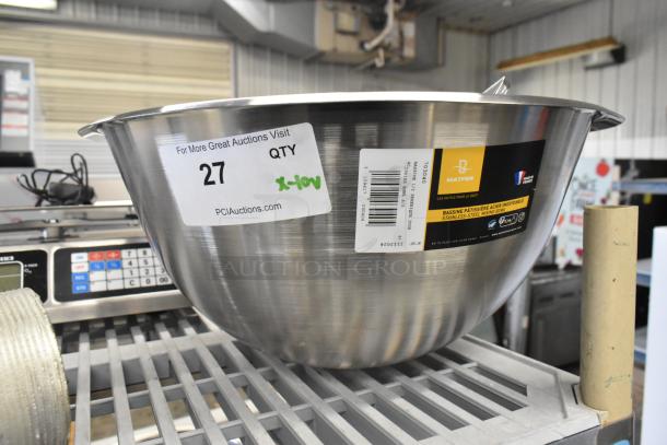 Stainless steel mixing bowl with Matfer brand label and auction tags, in new condition, on a metal shelf.
