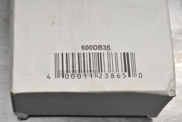 Barcode on a white box labeled "600DB35," part of a mixed auction lot including new scratch and dent items.