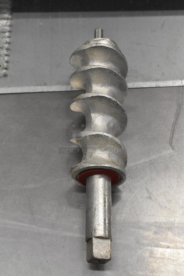 Brand new scratch and dent meat grinder auger. Metal construction, minor surface marks visible, no packaging.