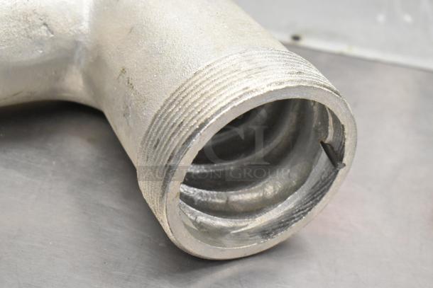 Brand new meat grinder attachment with scratched surface, showing threaded end. Includes auger, tray, and pusher.