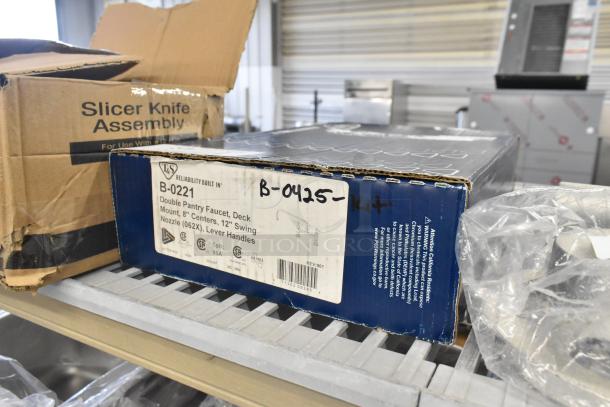 BRAND NEW T&S B-0221 deck mounted faucet, 12" swing nozzle, 8" centers, 18.39 GPM, Eterna cartridges, lever handles, in box.