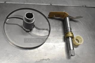 BRAND NEW SCRATCH AND DENT! 190m22hsknif slicer knife assembly for #22 slicer and shredder attachments, metal and plastic components shown on metallic surface.