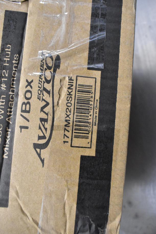 Alt text: "Box labeled Avancico Equipment, 177MX20SKNIF, for slicer and shredder attachments, scratch and dent condition."