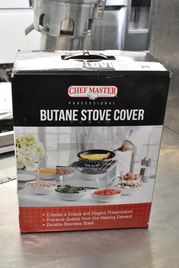Chef Master 90217 stainless steel butane stove cover in box. Measures 7 3/16" x 14 1/2" x 12". New scratch and dent condition.