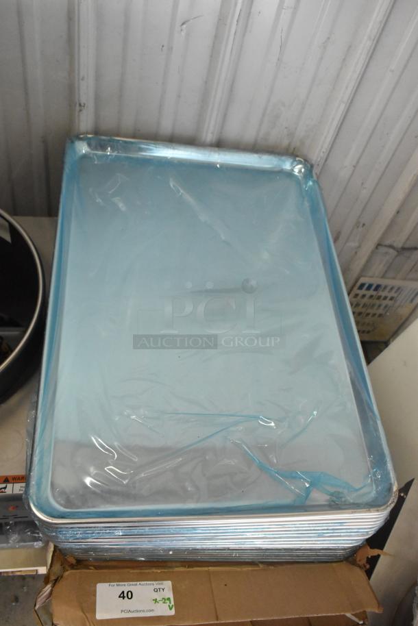 29 brand new scratch and dent aluminum bun pans, 18"x26", 19 gauge. Wrapped stack on cardboard with labeling.
