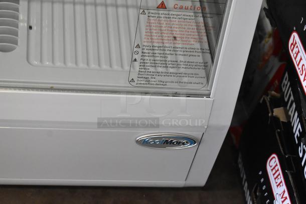 BRAND NEW SCRATCH AND DENT KoolMore CDC-3C-WH Countertop Display Refrigerator, 3.6 Cu Ft, 110-120 Volts. Caution label visible.