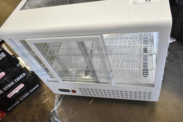 Brand new KoolMore CDC-3C-WH countertop display refrigerator, 3.6 cu ft, scratch and dent, with glass sliding doors.