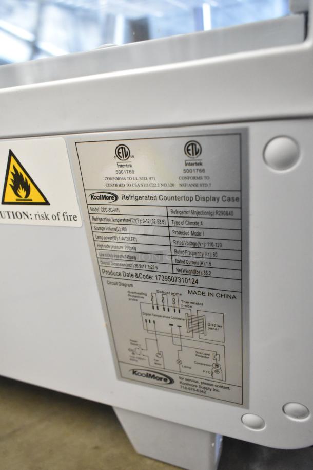 BRAND NEW KoolMore CDC-3C-WH countertop display refrigerator, 3.6 Cu Ft. Features ETL certification label and technical specifications.