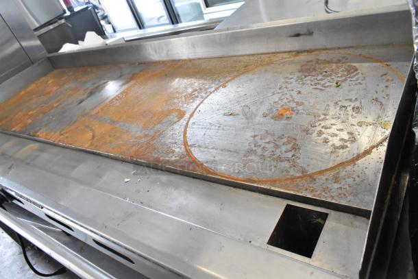 American Range commercial countertop flat top griddle on chef base, shows signs of surface rust and wear, includes 4 drawers.