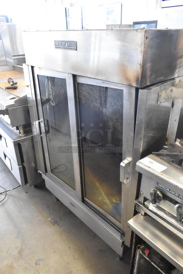 American Range commercial gas rotisserie oven in stainless steel. Features include glass doors, sturdy build, and branded label.