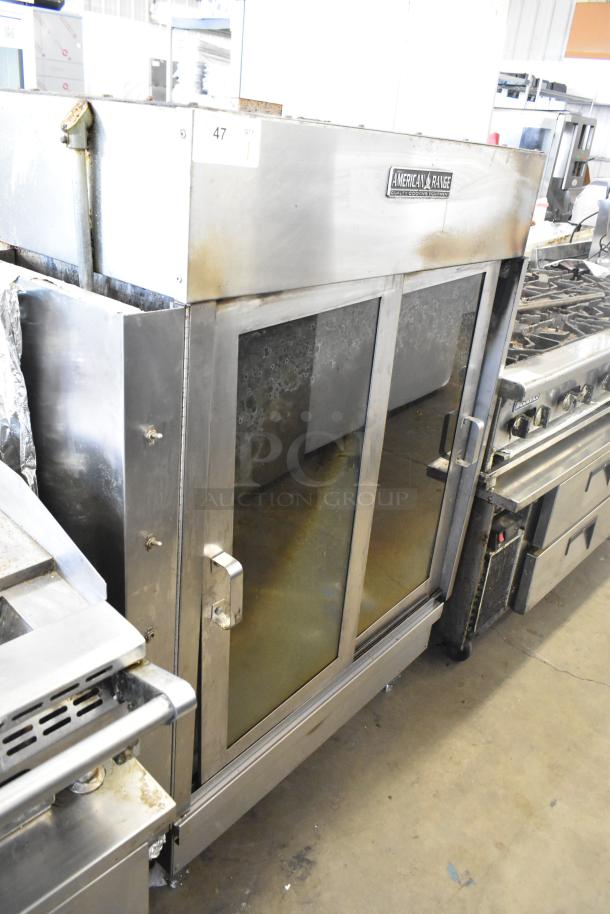 American Range commercial gas rotisserie oven with glass doors and stainless steel exterior. Visible wear. Model label present.