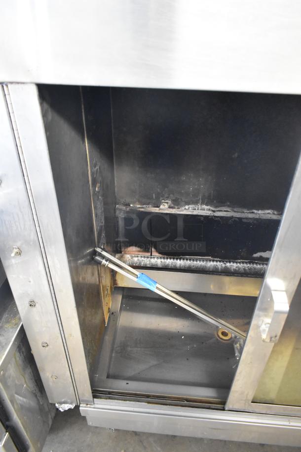 American Range Commercial Gas Rotisserie Oven showing interior condition and stainless steel construction.