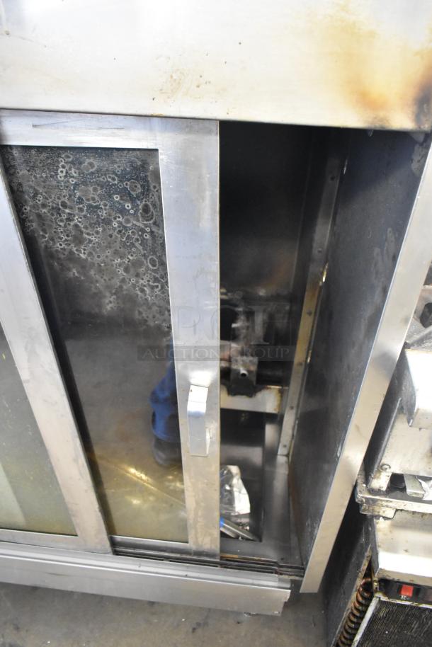 American Range Commercial Gas Rotisserie Oven, stainless steel, used condition, with glass door and visible interior.