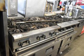 Radiance commercial countertop gas range, 6 burners, paired with a 5 burner range on Everest 4 drawer chef base. Used condition.