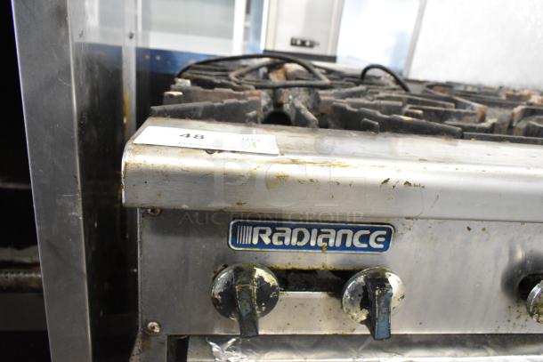 Radiance Commercial 6-Burner Gas Range on Everest 4-Drawer Chef Base, visible wear, includes labeled control knobs.