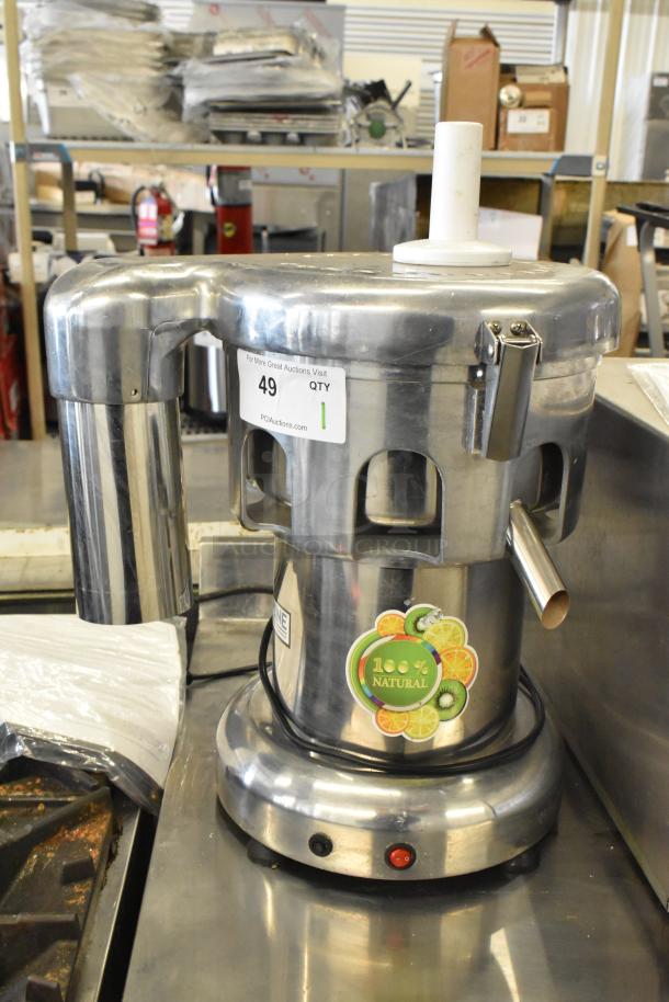Commercial countertop citrus juicer, 110 volts, 1 phase; stainless steel, 100% natural label, visible tagging.