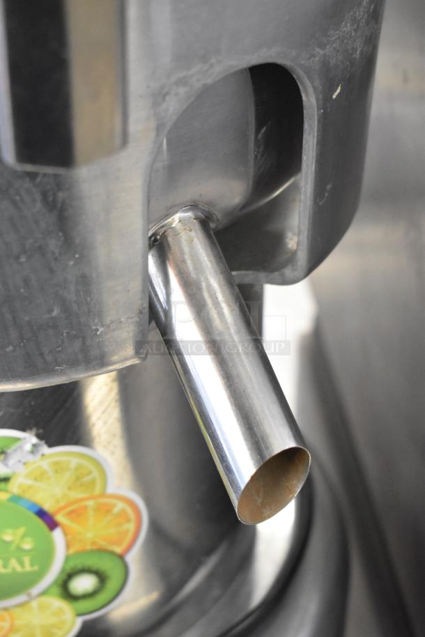 Commercial countertop citrus juicer, stainless steel spout, 110 volts, 1 phase, includes fruit graphic label.