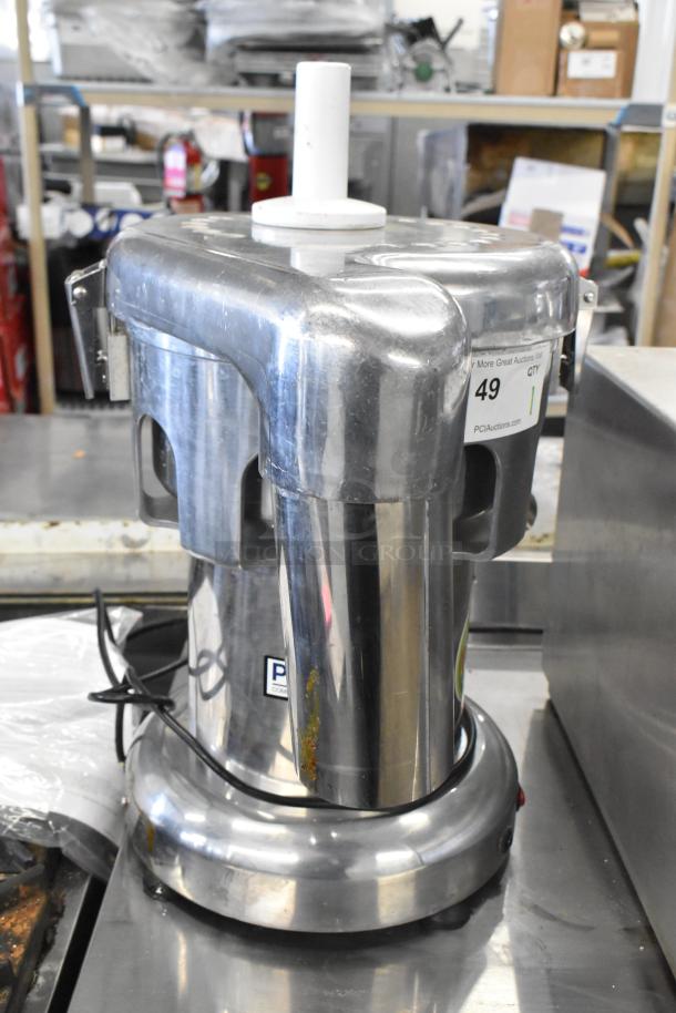 Commercial countertop citrus juicer, stainless steel, 110 volts, 1 phase. Features a visible power cord, item tag 49.