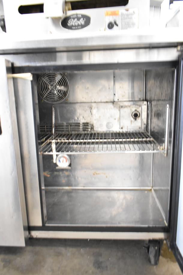 Turbo Air TWR-48SD 2 Door Undercounter Cooler, commercial casters, 115V, interior view, visible wire shelf, fan.