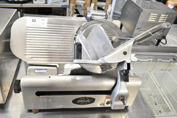 Globe commercial countertop meat slicer with blade sharpener, 115 volts, 1 phase, stainless steel, label visible, good condition.