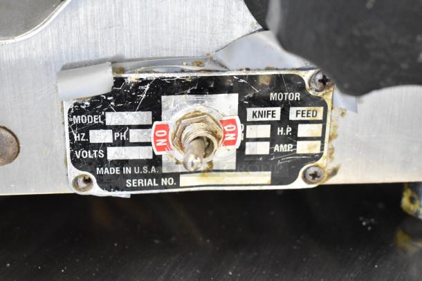 Globe commercial countertop meat slicer with blade sharpener. Features include 115 volts, 1 phase. Label indicates "Made in USA."