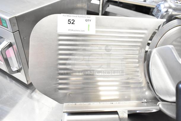 Globe Commercial Meat Slicer with blade sharpener, used condition. 115 volts, 1 phase. Auction tag visible.