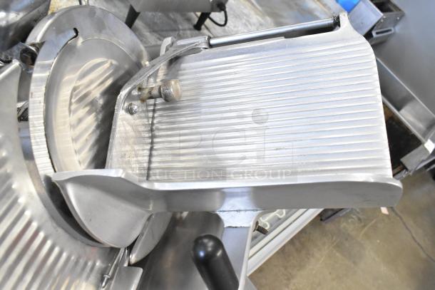 Globe commercial countertop meat slicer with blade sharpener, 115 volts, 1 phase, in used condition.