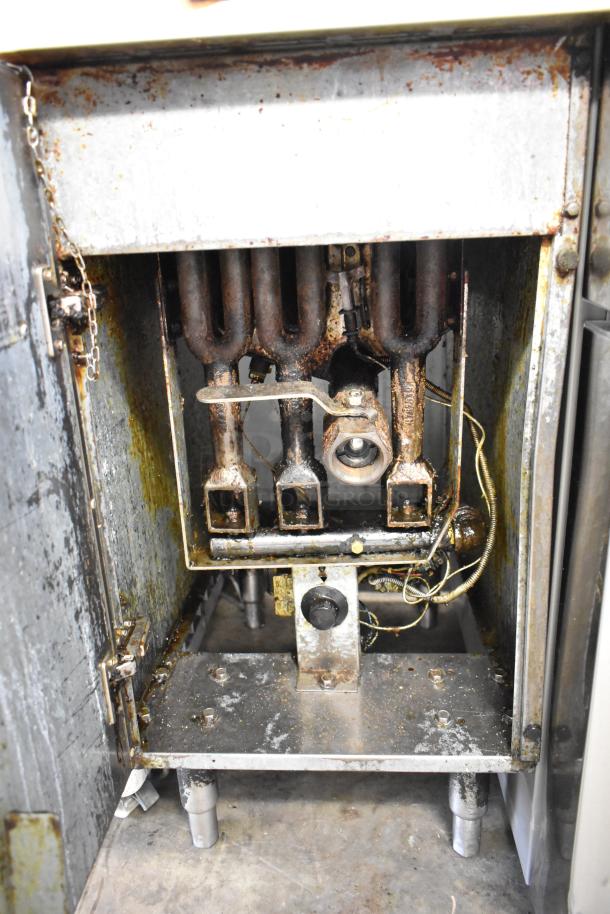 Qualite Commercial Floor Style gas-powered deep fat fryer, showing internal mechanisms. Used condition with visible wear.