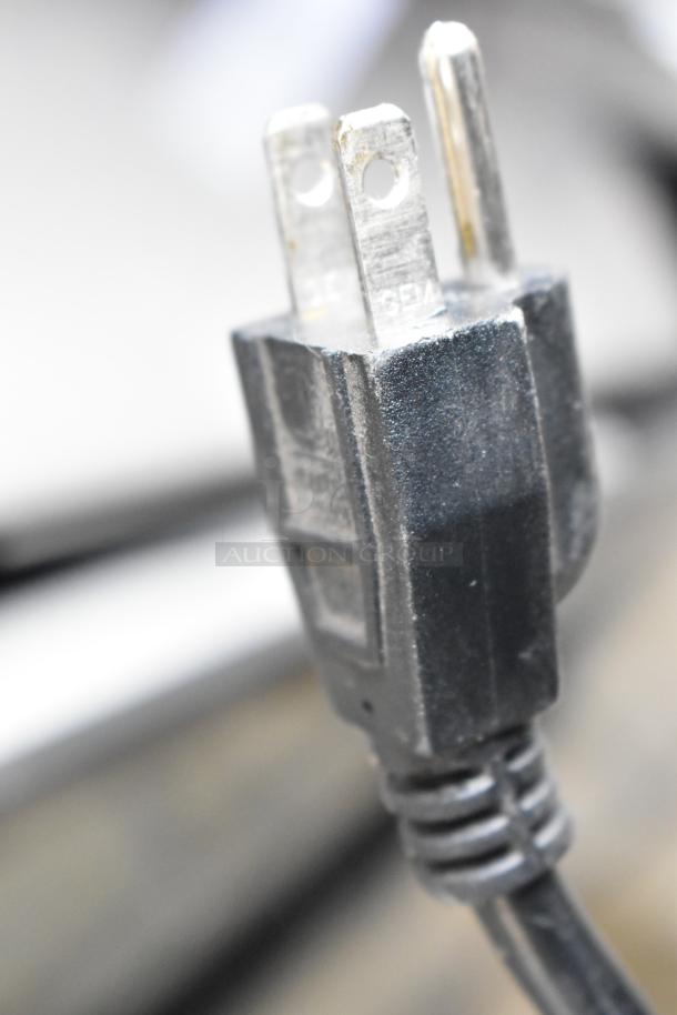 Close-up of a black power plug for a 2022 Scotsman NH0622A-1B ice head on Lancer TP30 beverage dispenser, 115 volts, 1 phase.