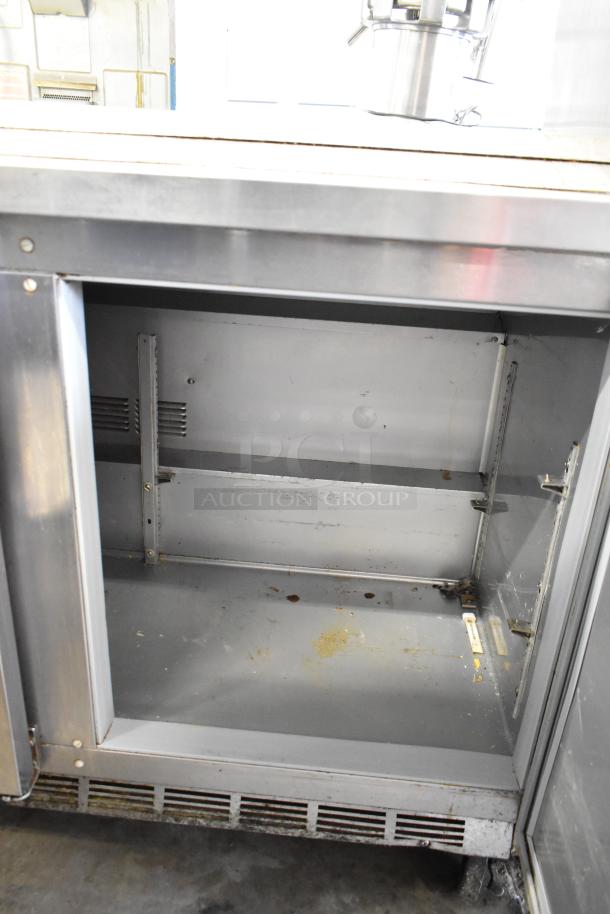 Beverage Air WTR72AY commercial 3-door undercounter cooler on casters, stainless steel, moderate wear, 115V, 1 phase.