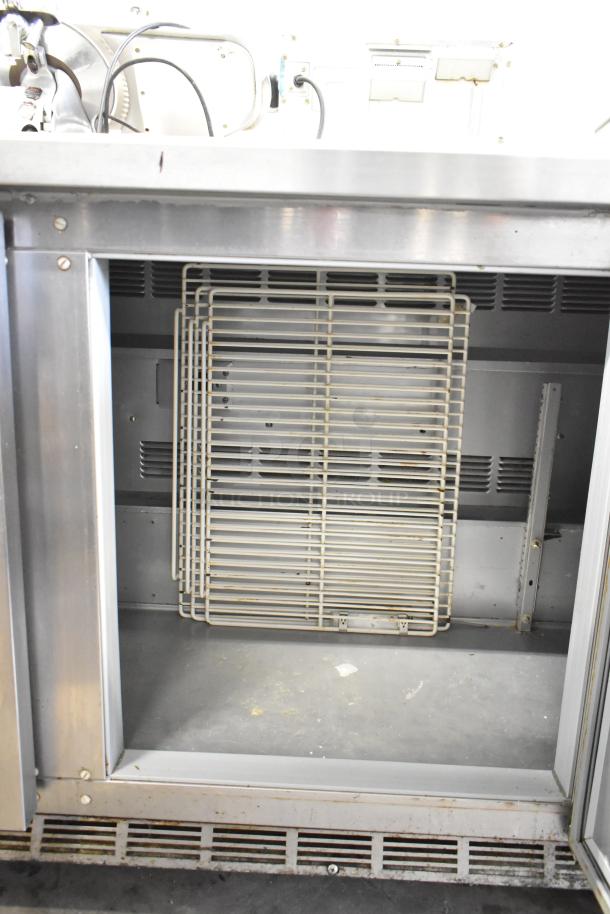Beverage Air WTR72AY 3-door undercounter cooler on casters, empty interior view. 115V, 1 phase, commercial use, stainless steel.