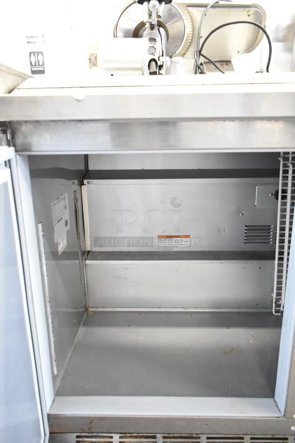 Beverage Air WTR72AY commercial 3-door undercounter cooler, on casters, 115V, 1 phase, with shelving, clean interior.